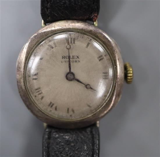 A gentlemans late 1930s silver Rolex Unicorn manual wind wrist watch, on associated leather strap.